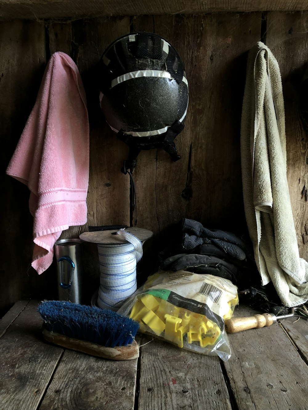 a wooden bench with various items on it