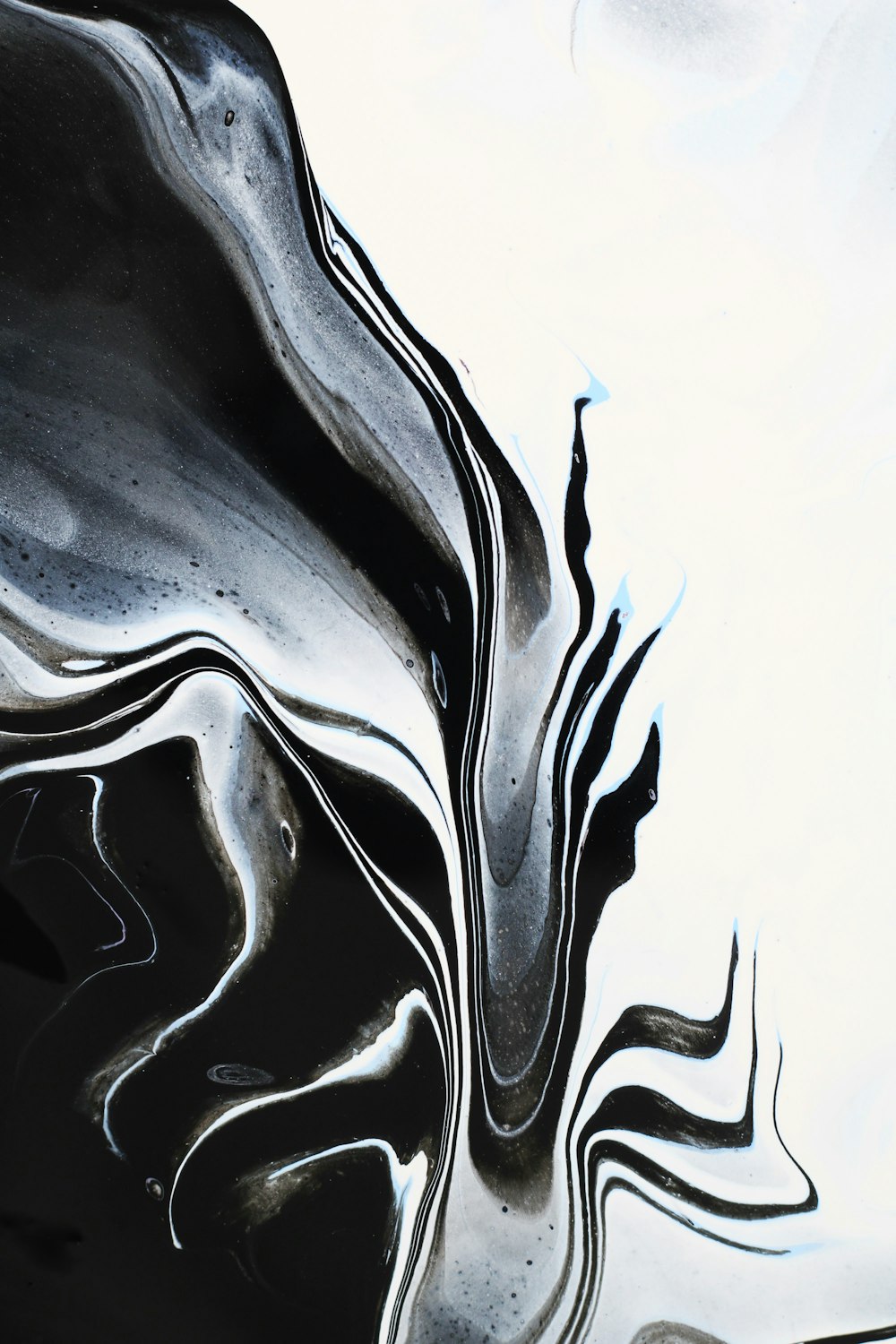 a close up of a black and white abstract painting