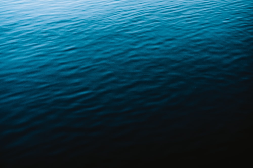 a boat floating on top of a large body of water