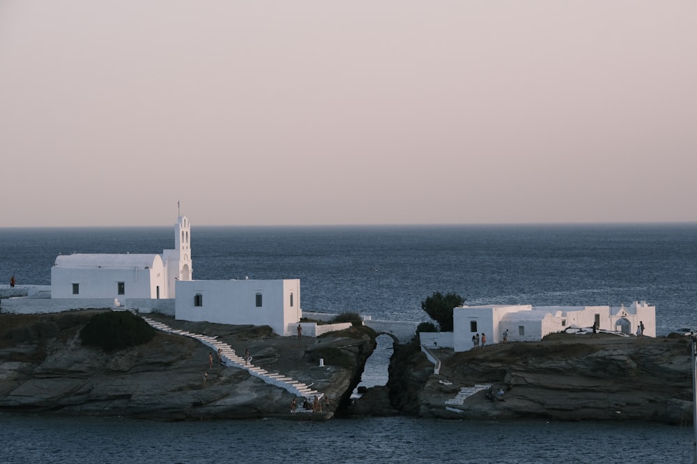 a small white church on a rocky outcropping