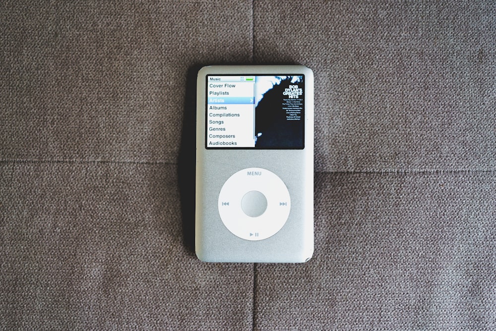 an ipod sitting on top of a couch