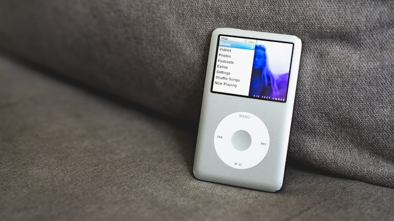 an ipod sitting on top of a couch