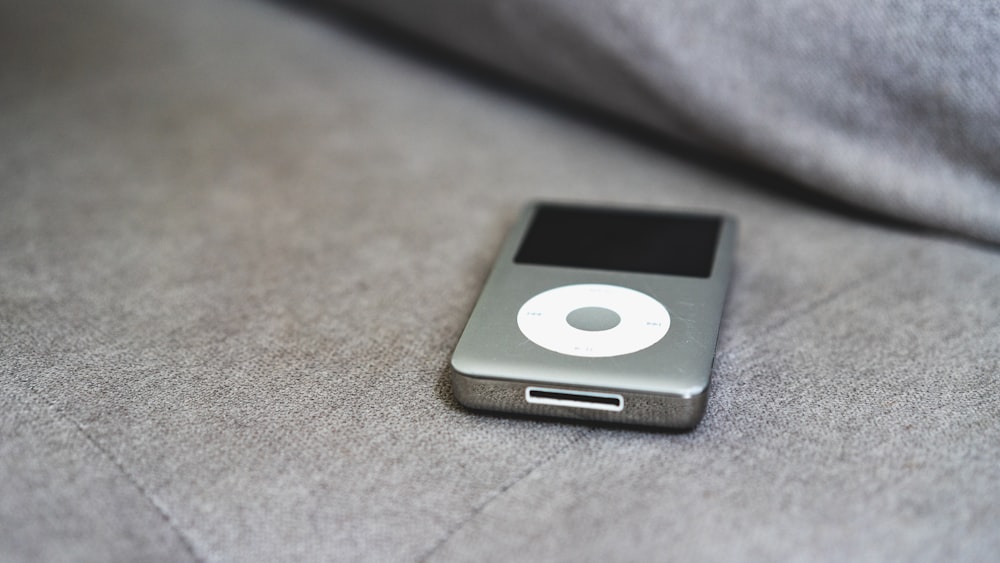a close up of an ipod on a couch