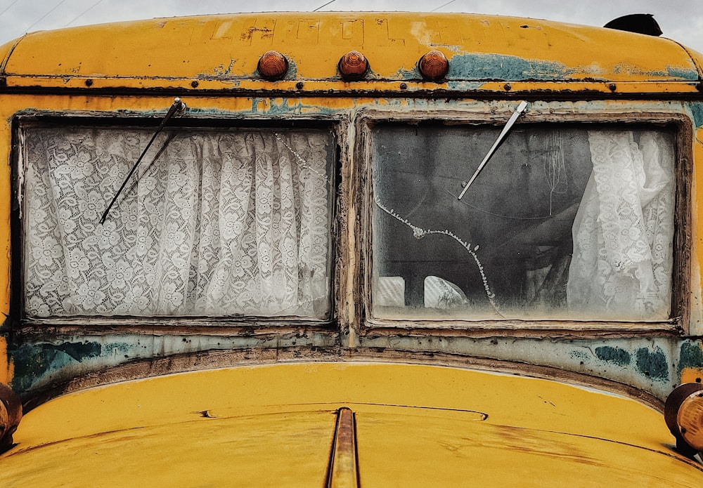 a close up of the window of a yellow school bus