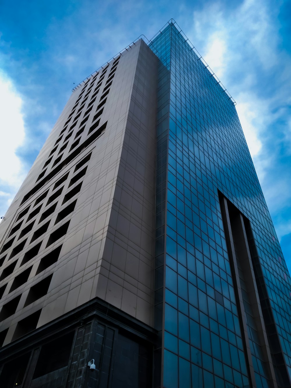 a very tall building with a sky background