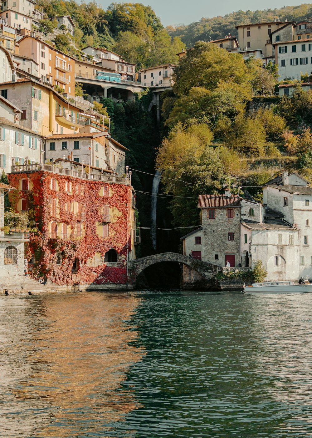 a body of water with buildings on the side of it