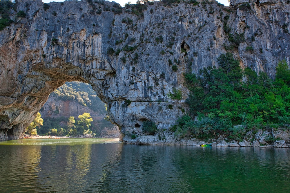 a large body of water with a cave in the middle of it