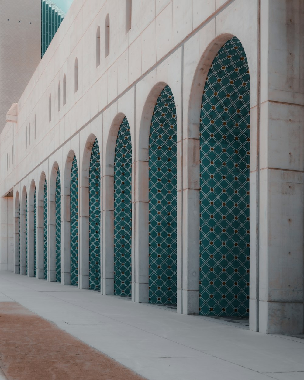 a row of arches in front of a building