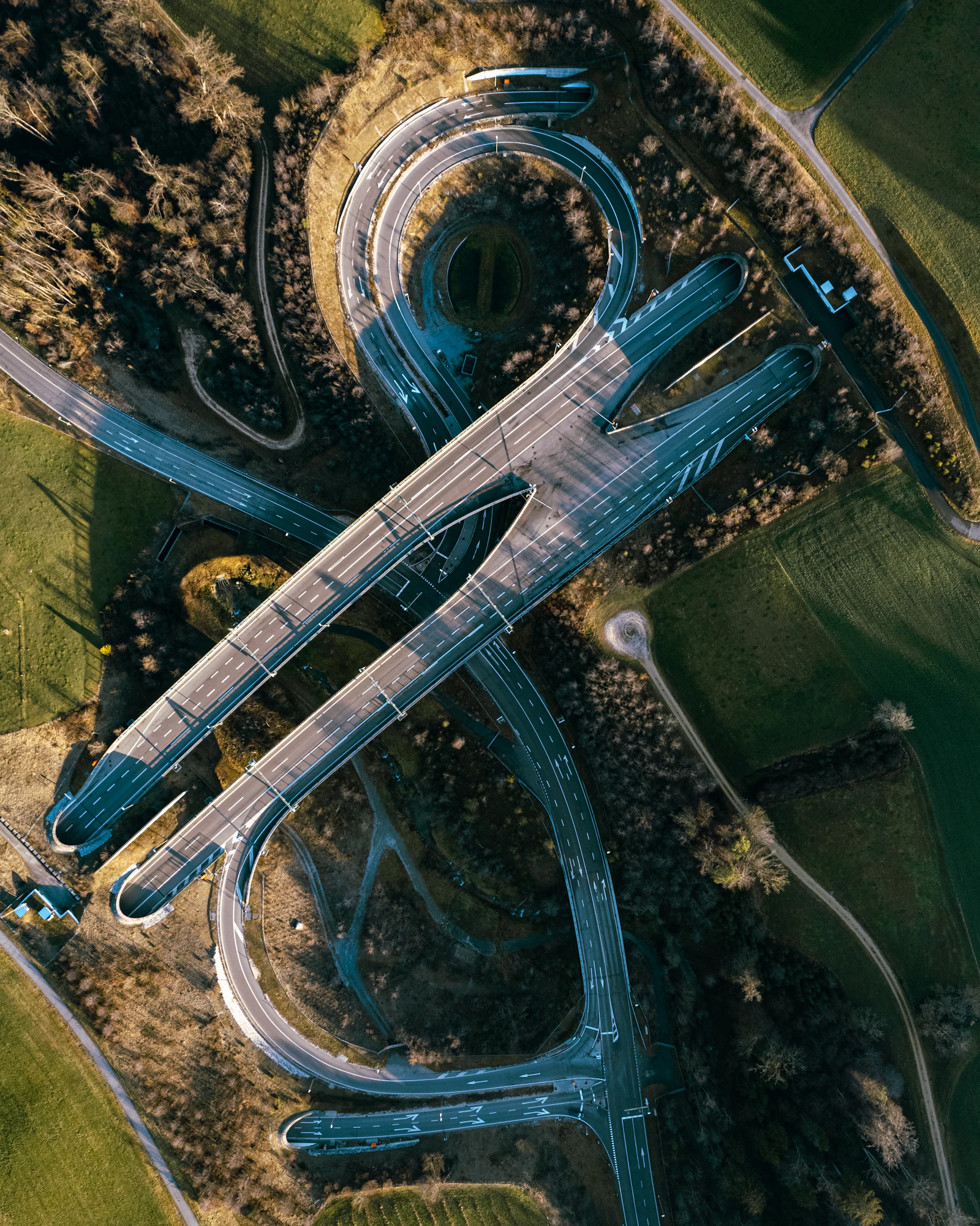 Aerial view of a Swiss motorway interchange through green countryside