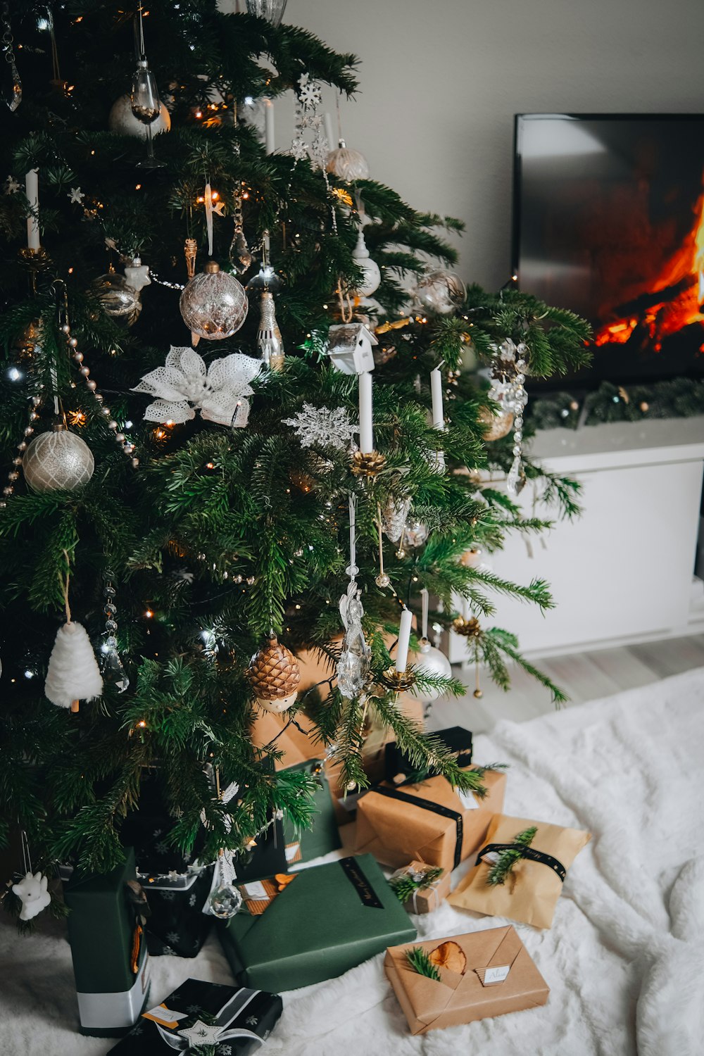 a christmas tree with presents under it