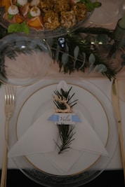 a place setting with pine cones and napkins