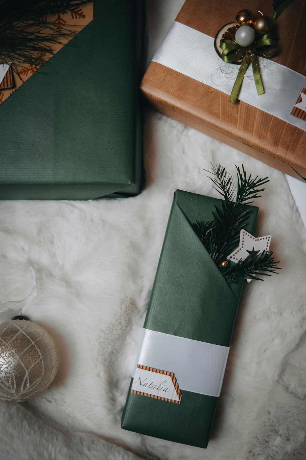 a christmas present wrapped in green and white paper