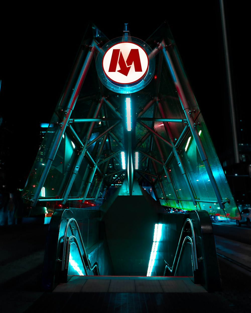 a metro station at night with neon lights