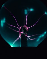 a glass ball with a purple light inside of it