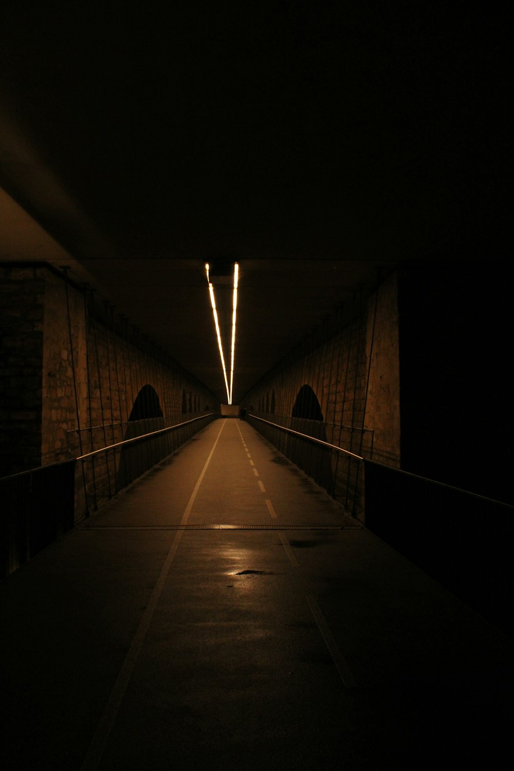 a dark tunnel with a light at the end