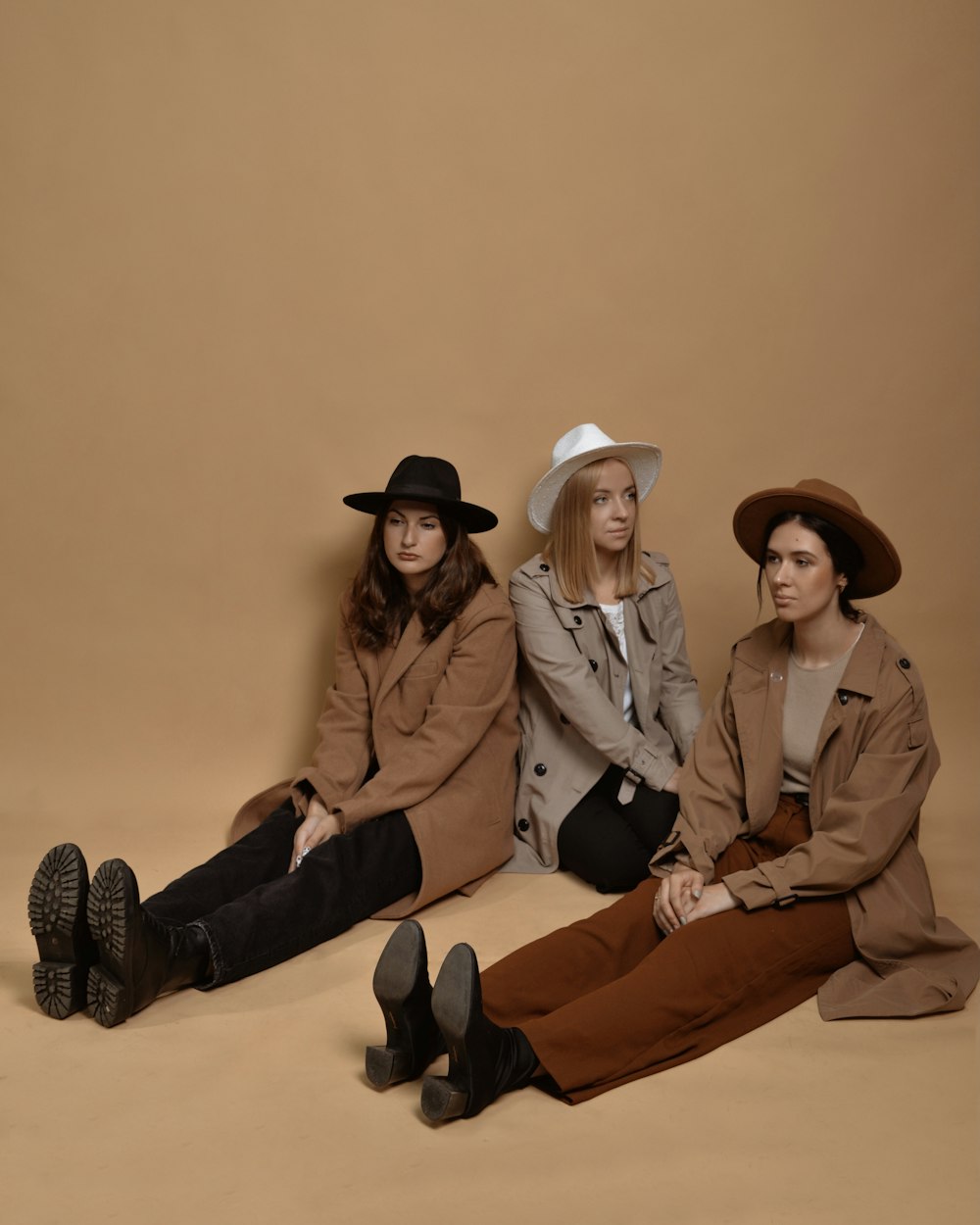 a group of three women sitting next to each other