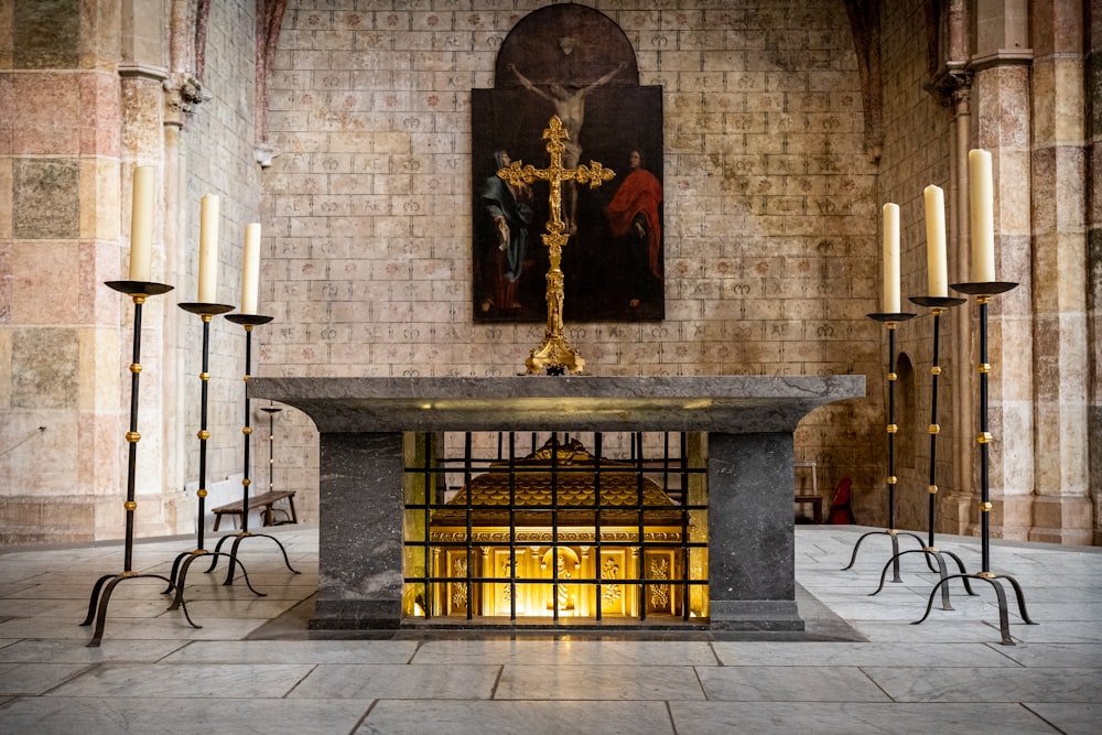 a church with candles and a crucifix in the center