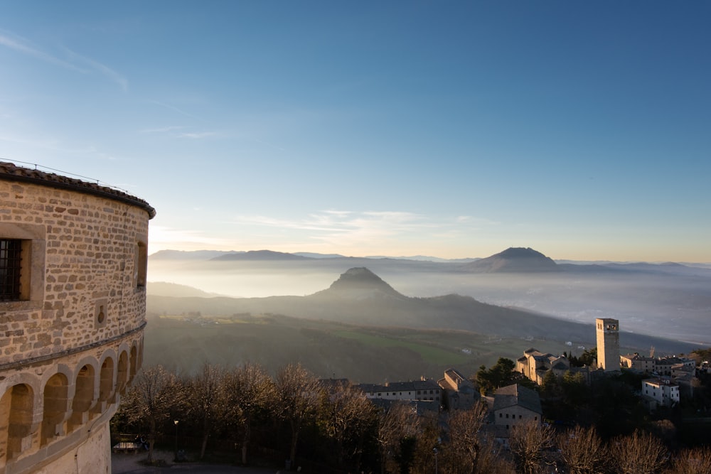 a view of a city with mountains in the background