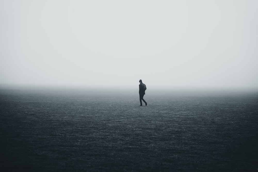 a person standing in the middle of a large body of water