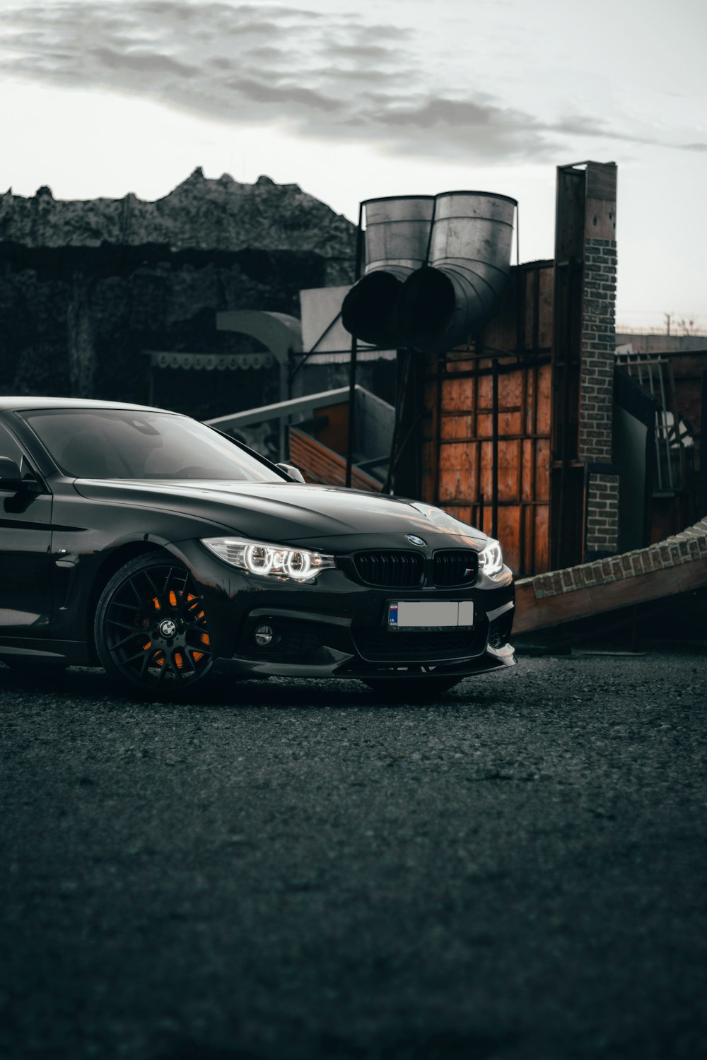 a black car parked in front of a building