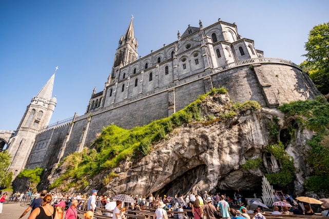 a group of people standing in front of a castle