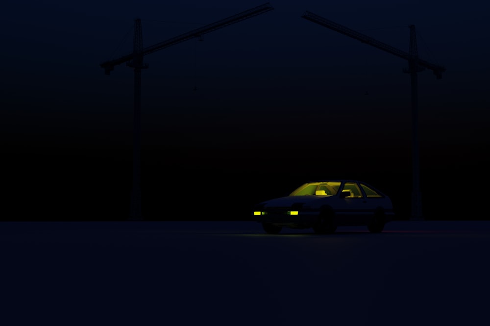 a car parked in the dark under power lines