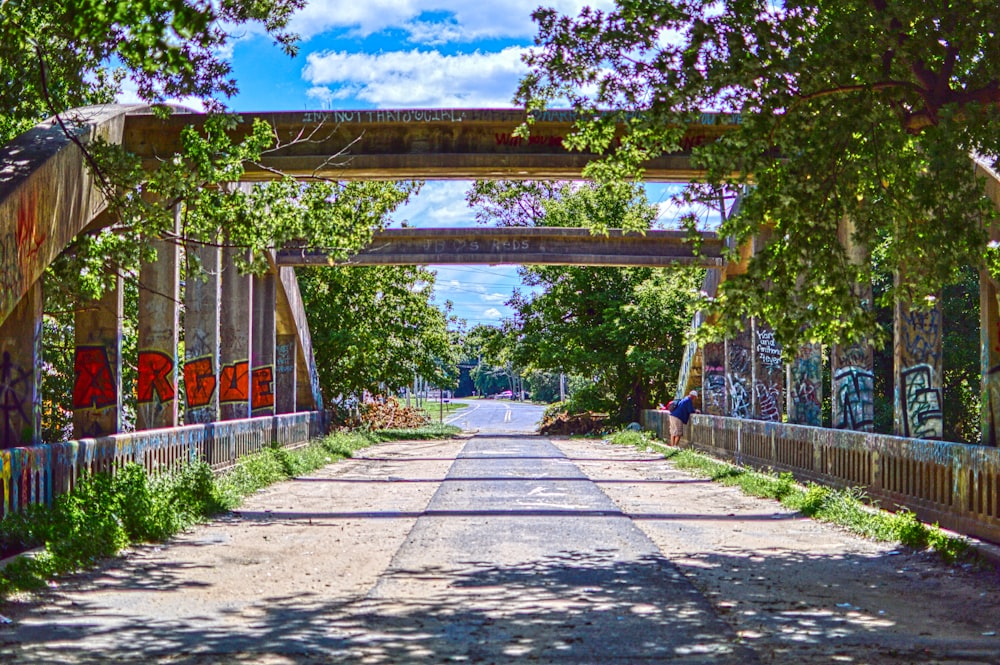 a bridge that has graffiti on it