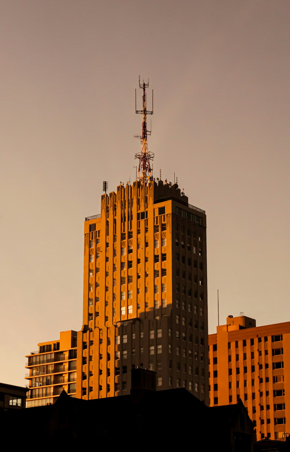 a tall building with a radio antenna on top of it