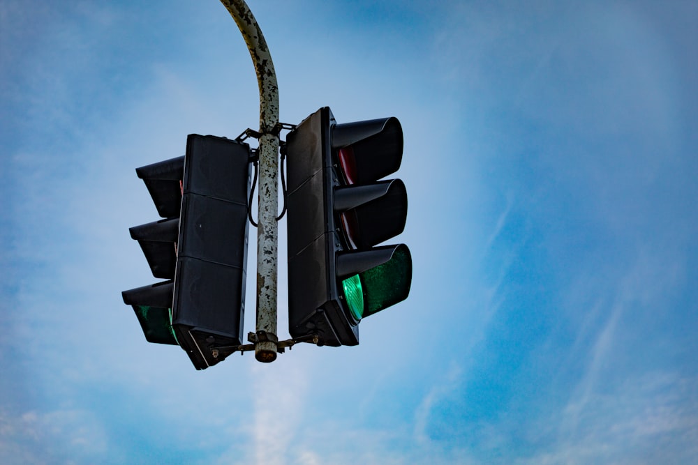 a traffic light hanging off the side of a pole