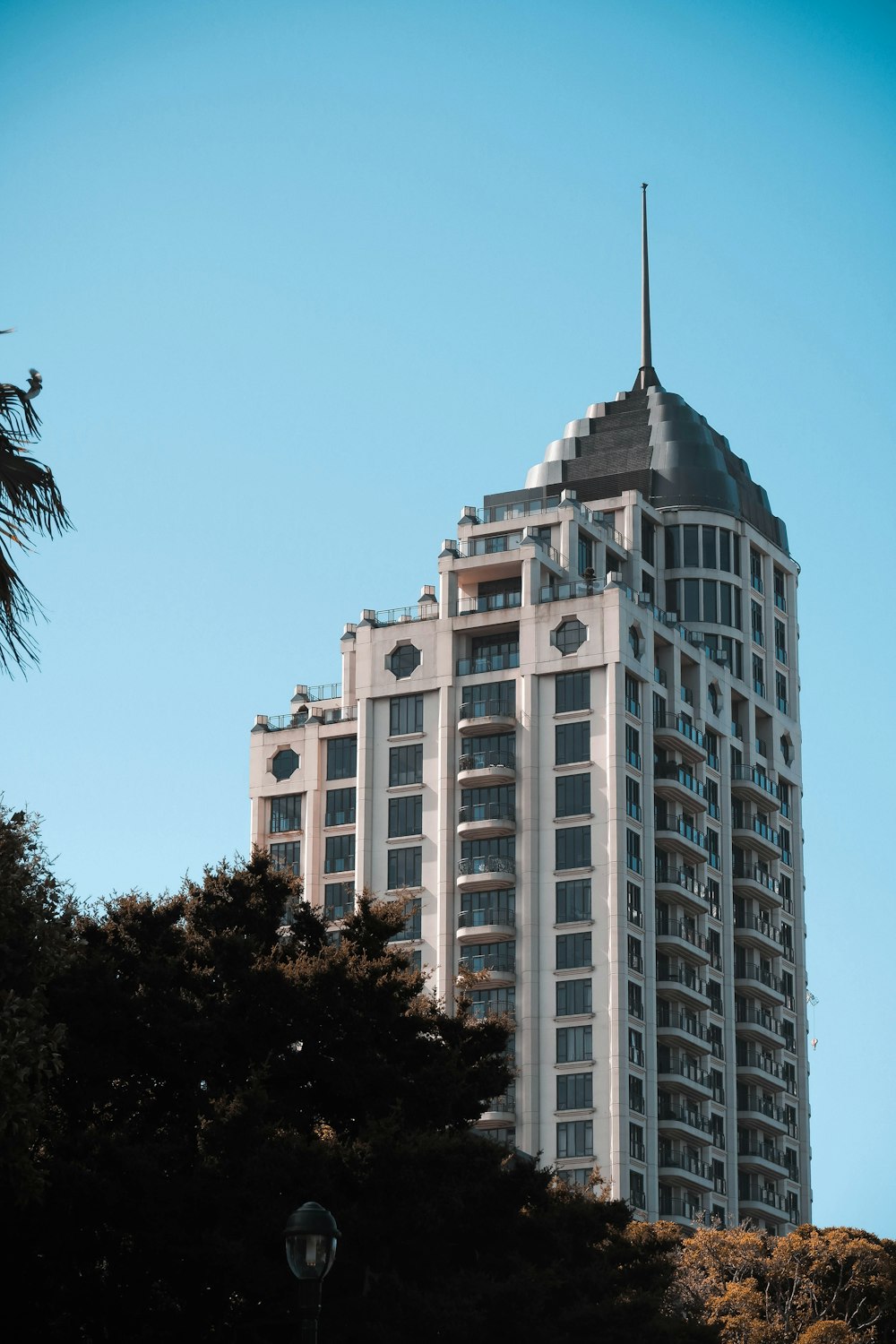 a tall white building with a steeple on top