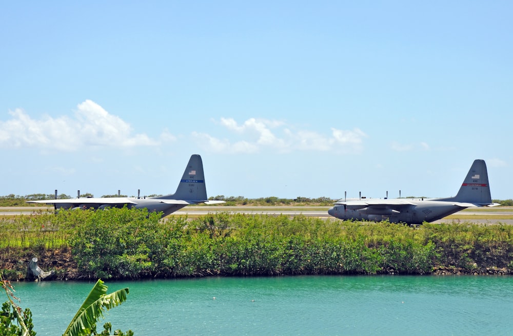 a couple of planes that are sitting on a runway