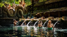 a group of people sitting in a pool of water