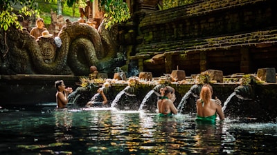 a group of people sitting in a pool of water
