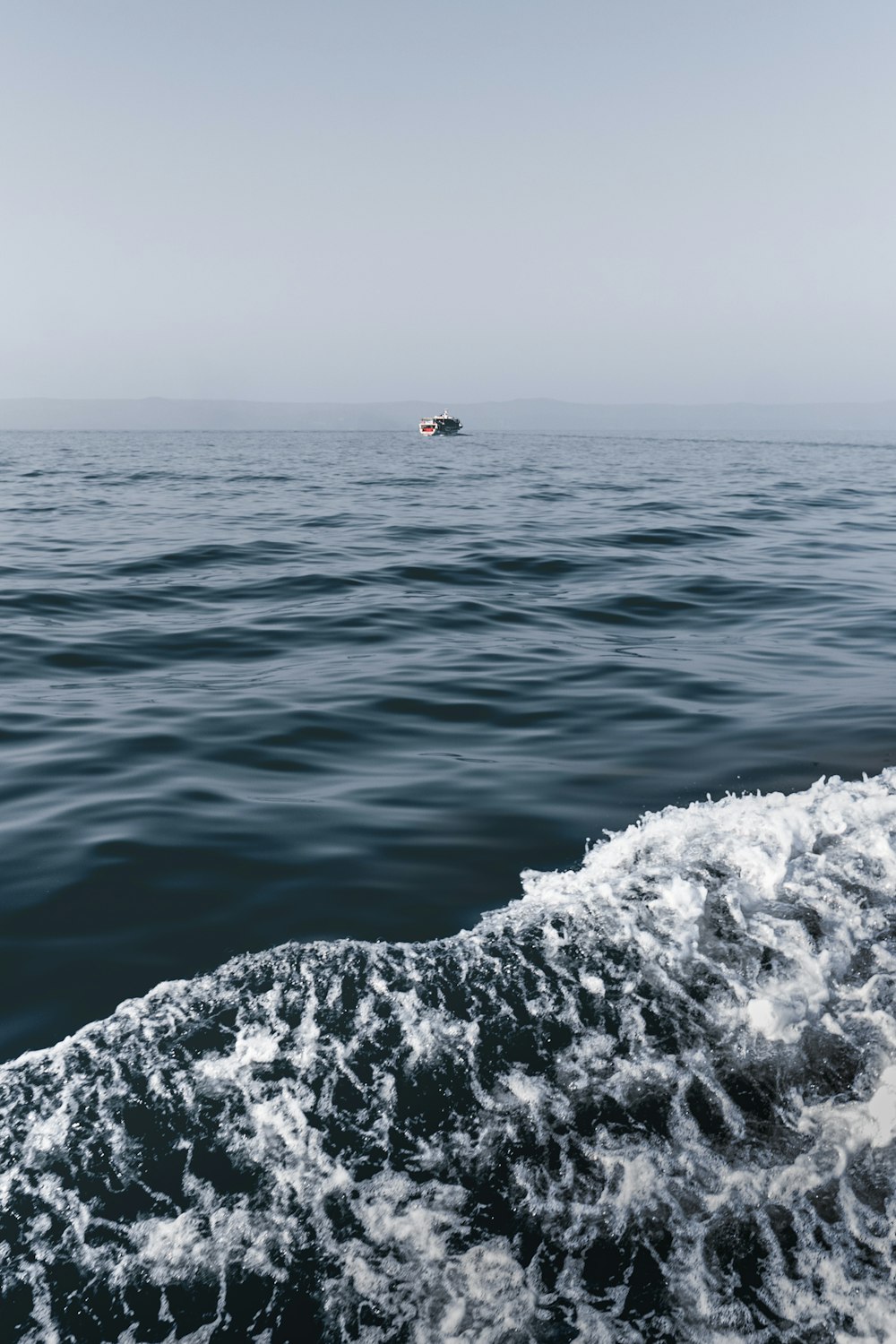 a boat in the middle of a body of water