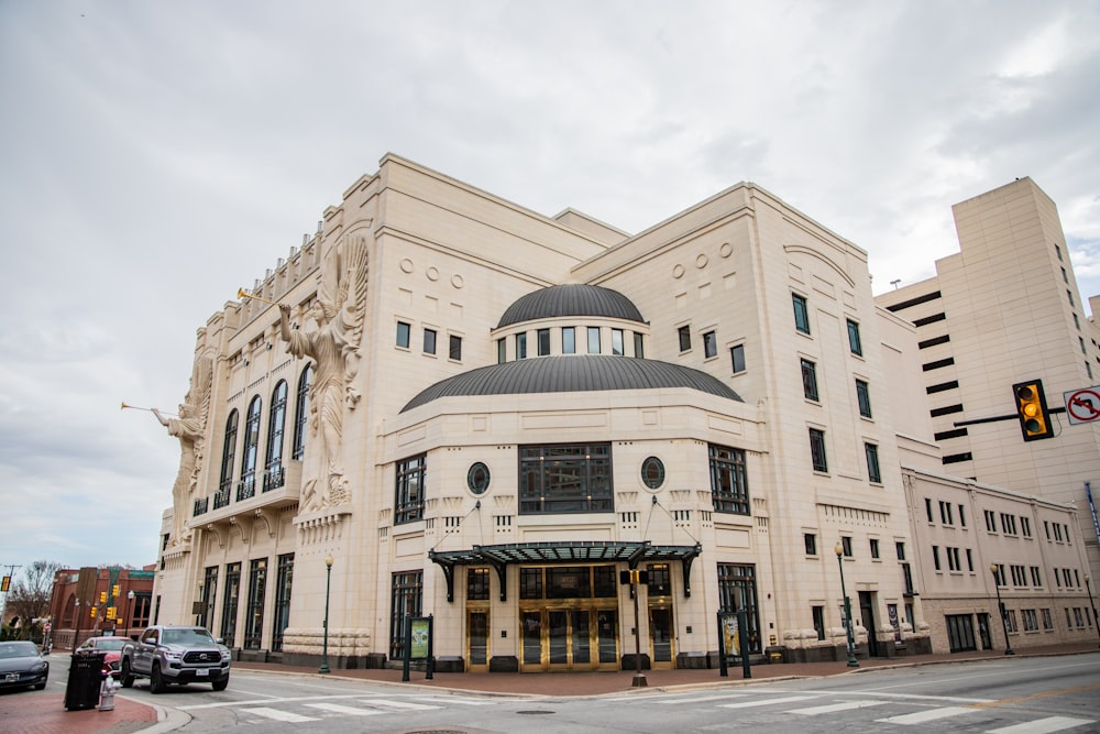 a large white building with a black roof