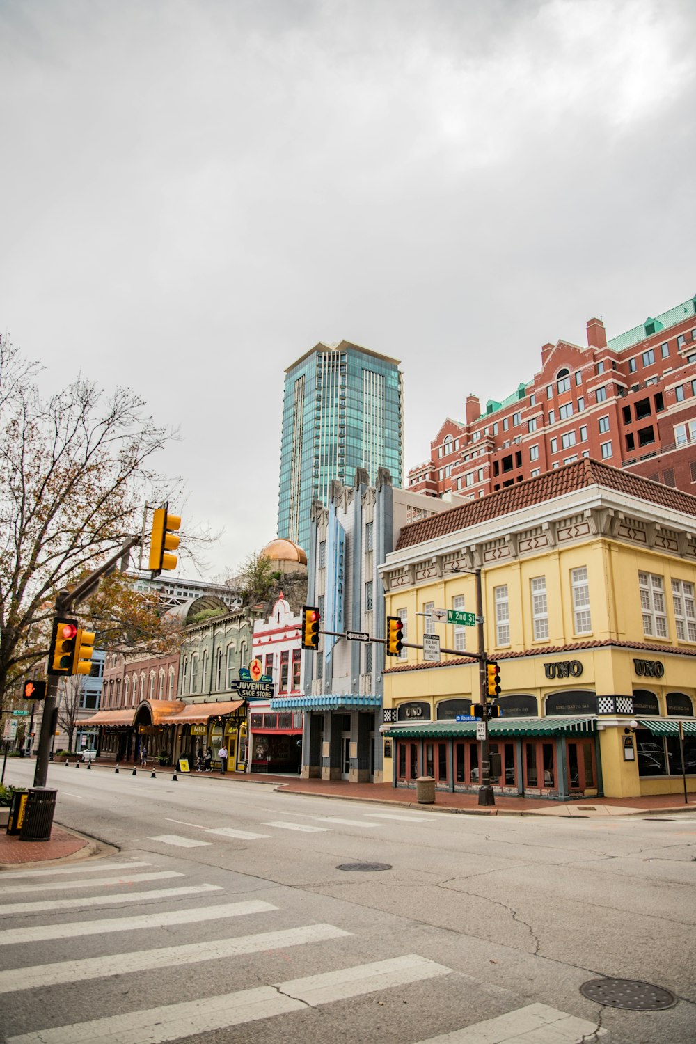 a city street with buildings and a traffic light