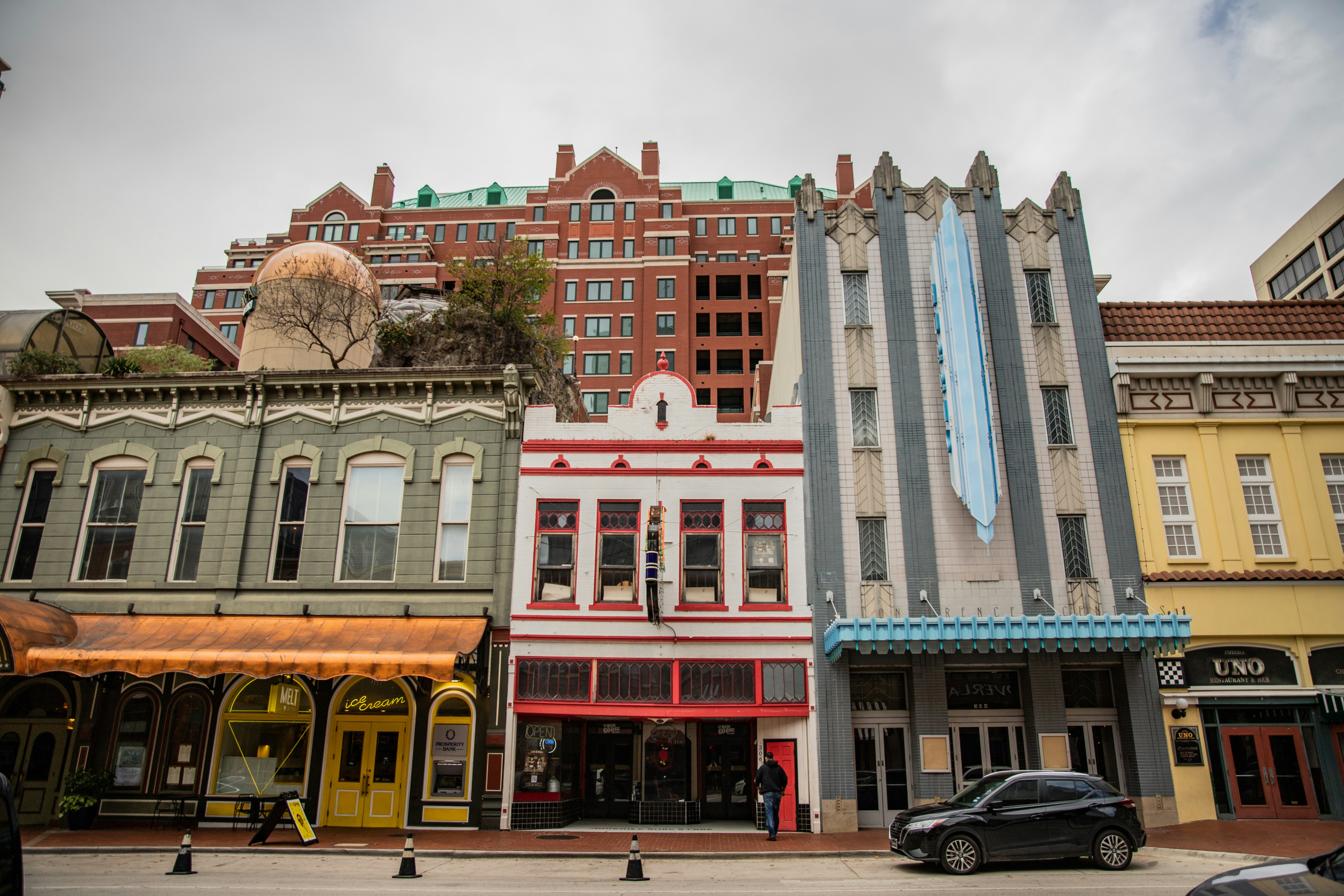 a row of buildings with a car parked in front of them, Downtown Fort Worth, Texas.