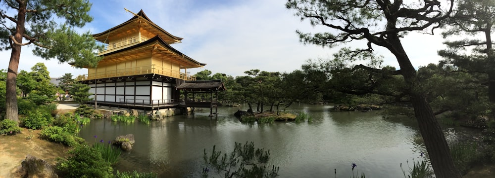 a large building sitting on top of a lush green hillside