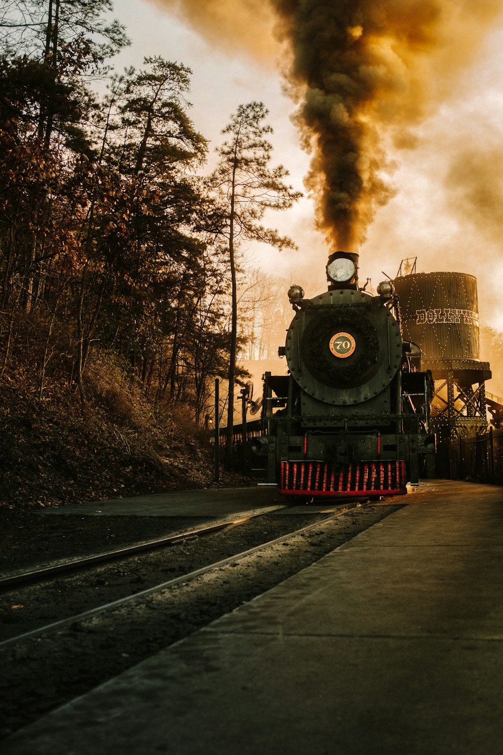 a steam engine train traveling down train tracks