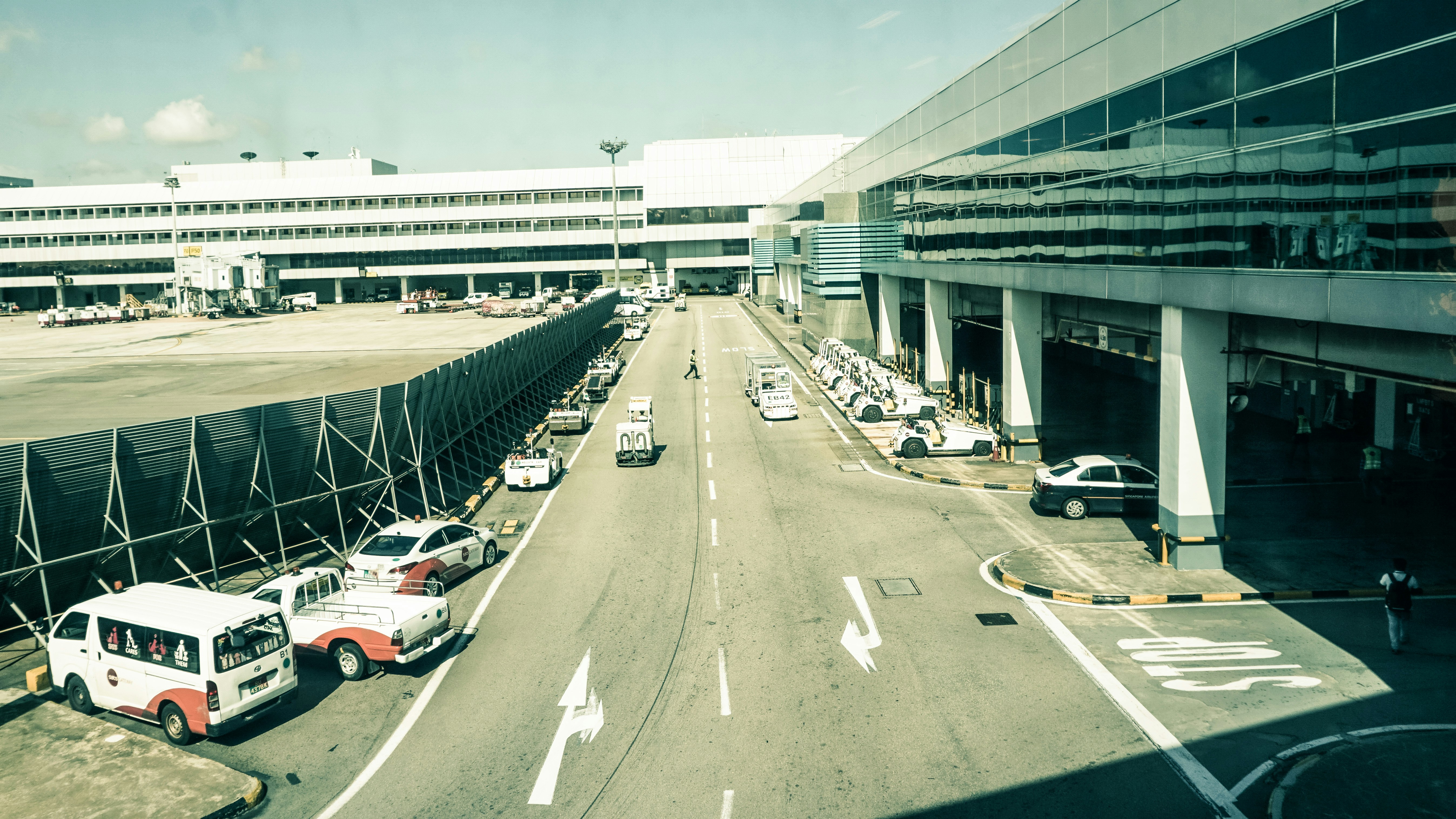 a view of an airport from a plane window, 