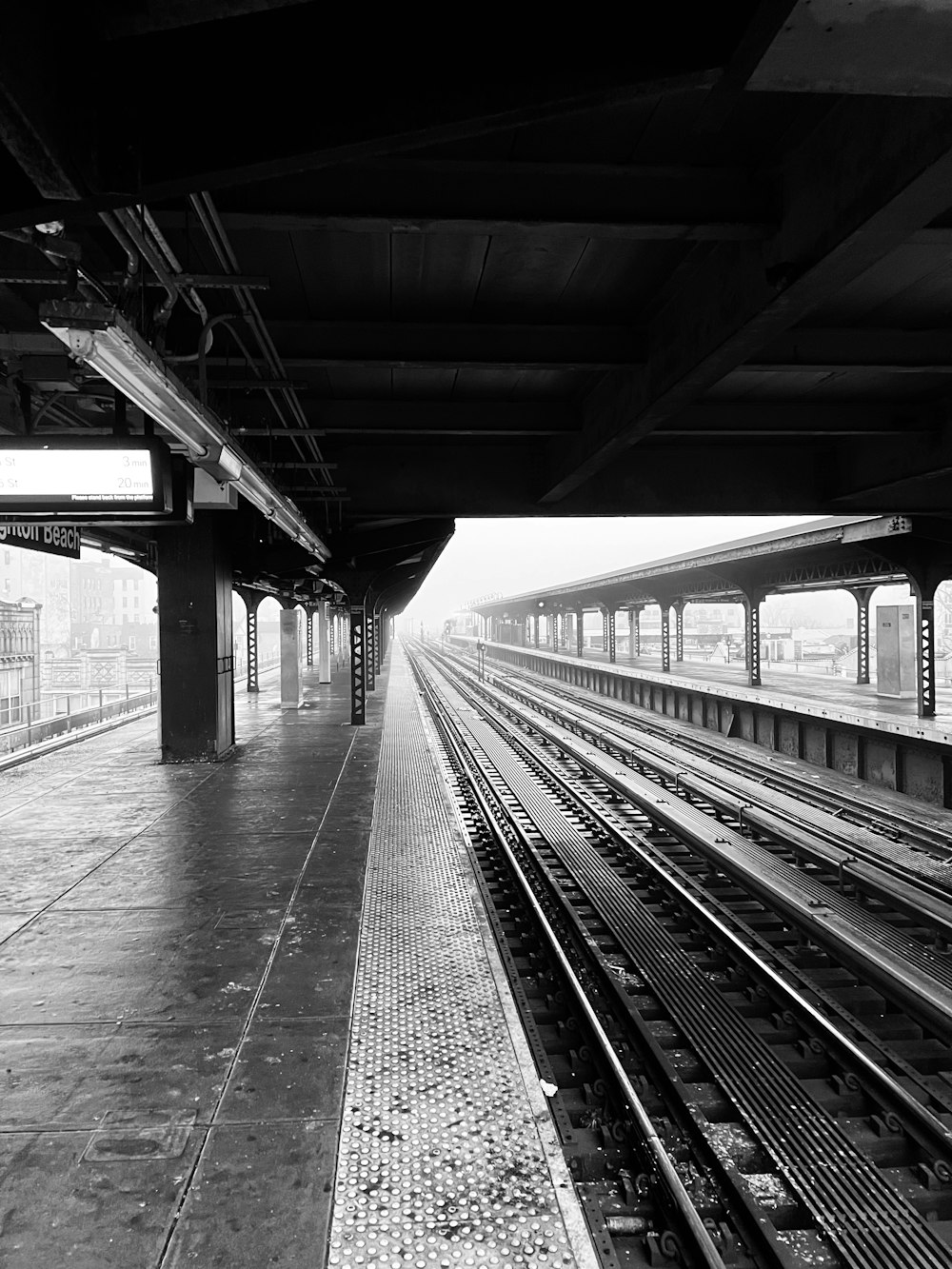 a black and white photo of a train station