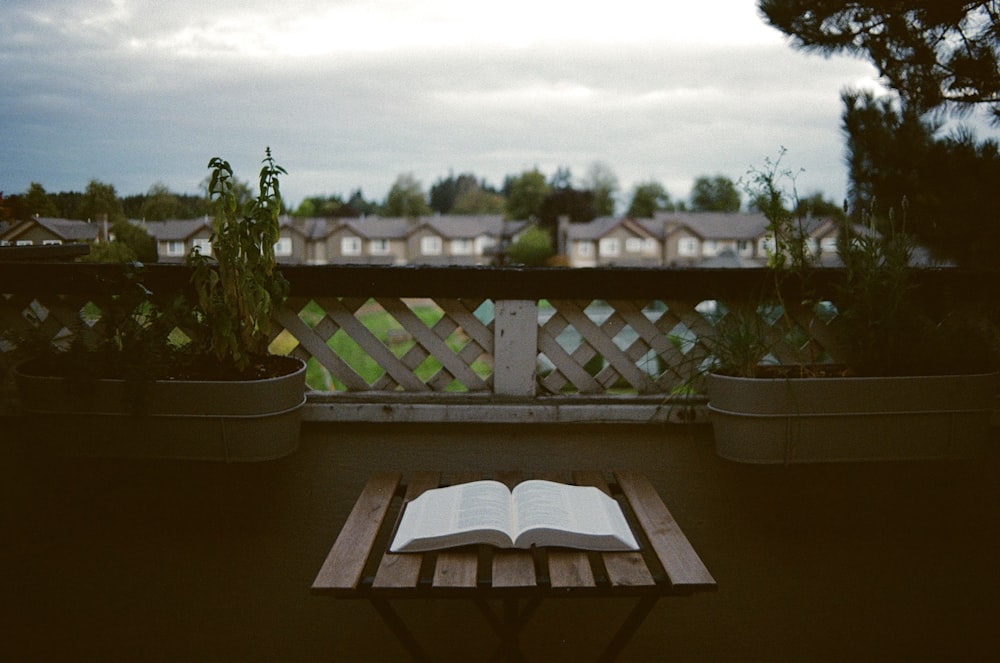 an open book sitting on top of a wooden table