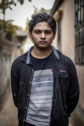 a man standing in front of a building