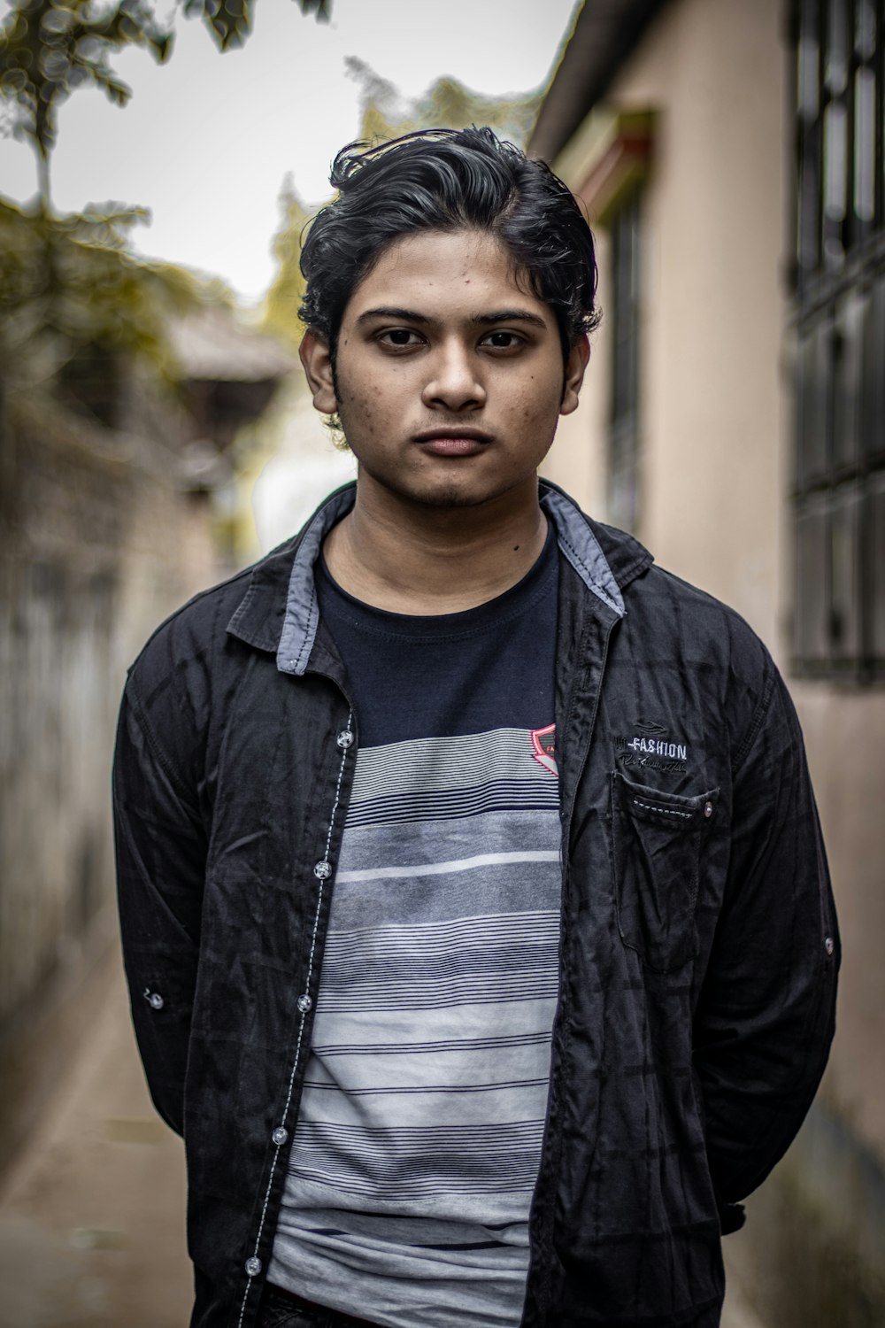 a man standing in front of a building