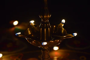 Traditional brass lamp softly illuminating the room corner.