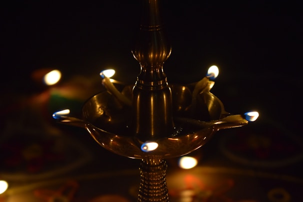 Elegant brass lamps with detailed engravings glowing softly in warm light.