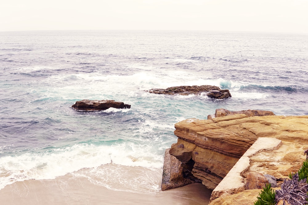 a view of the ocean from a cliff