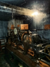 a steam engine sitting on top of a wooden table