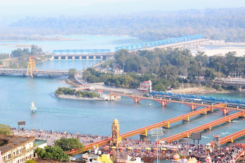 a train traveling over a bridge over a river