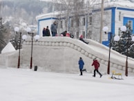 Children playing and making snowmen during a fun-filled snow activity session.